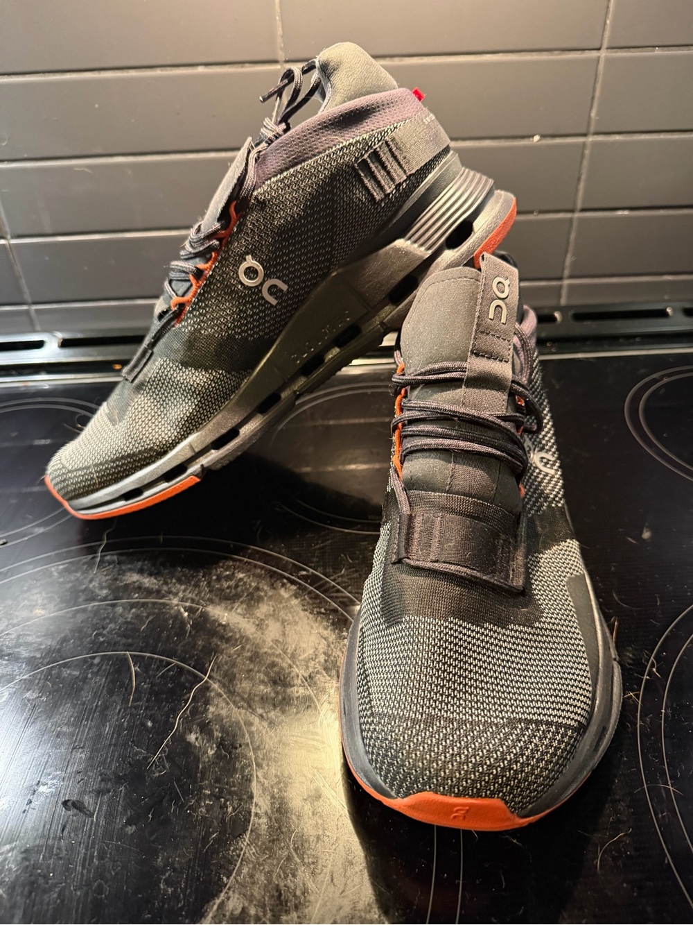 On Running Men’s Cloudnova Black/Orange Running Sneakers